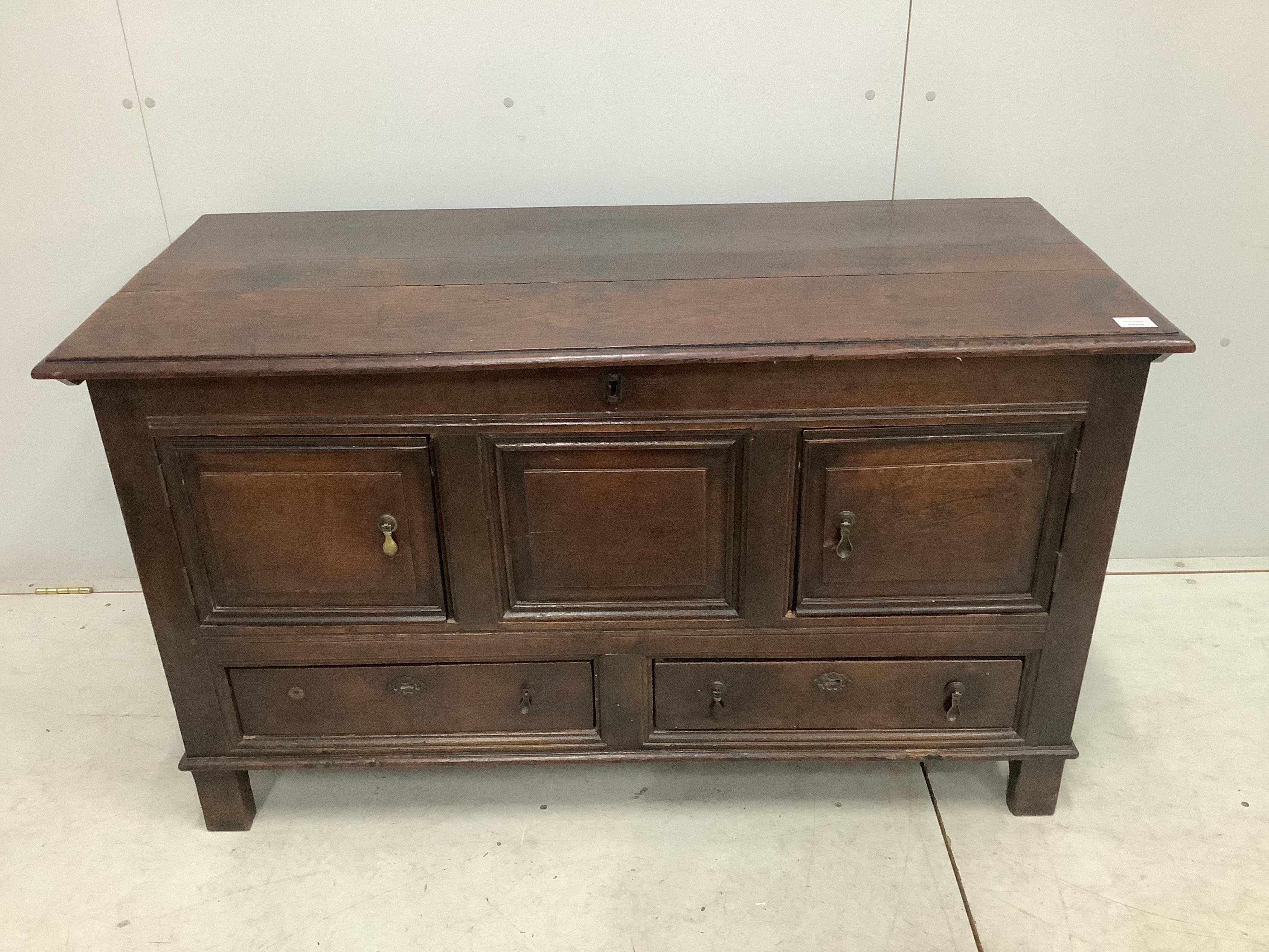 An 18th century oak mule chest, adapted, width 132cm, depth 56cm, height 77cm. Condition - fair